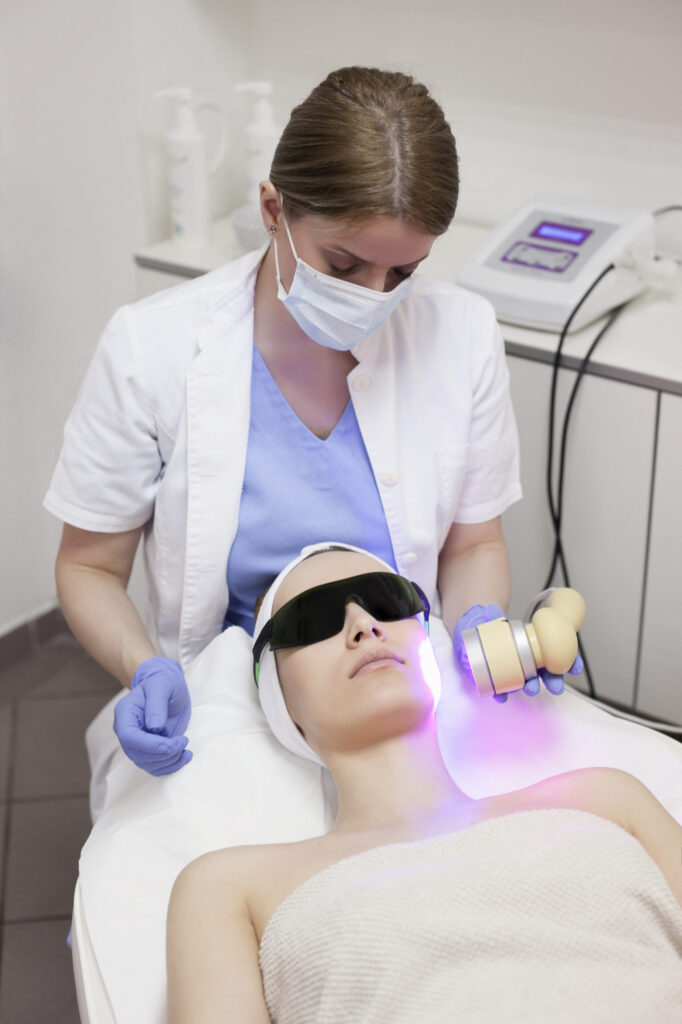Young beautiful woman in the beauty salon on the face treatment